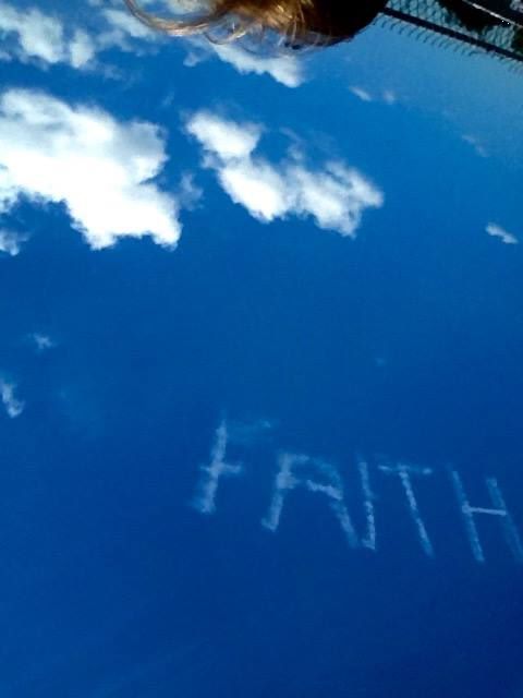 sky writing the word faith