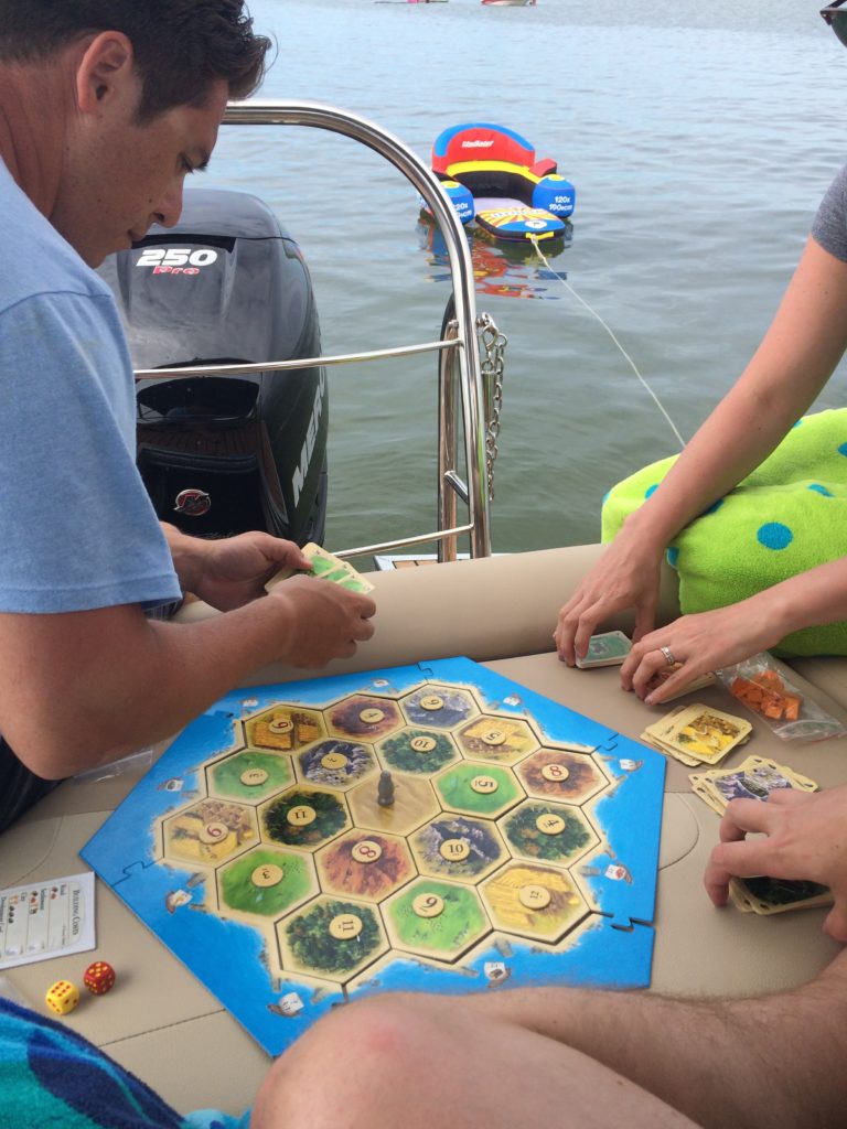 settlers of catan on the pontoon boat